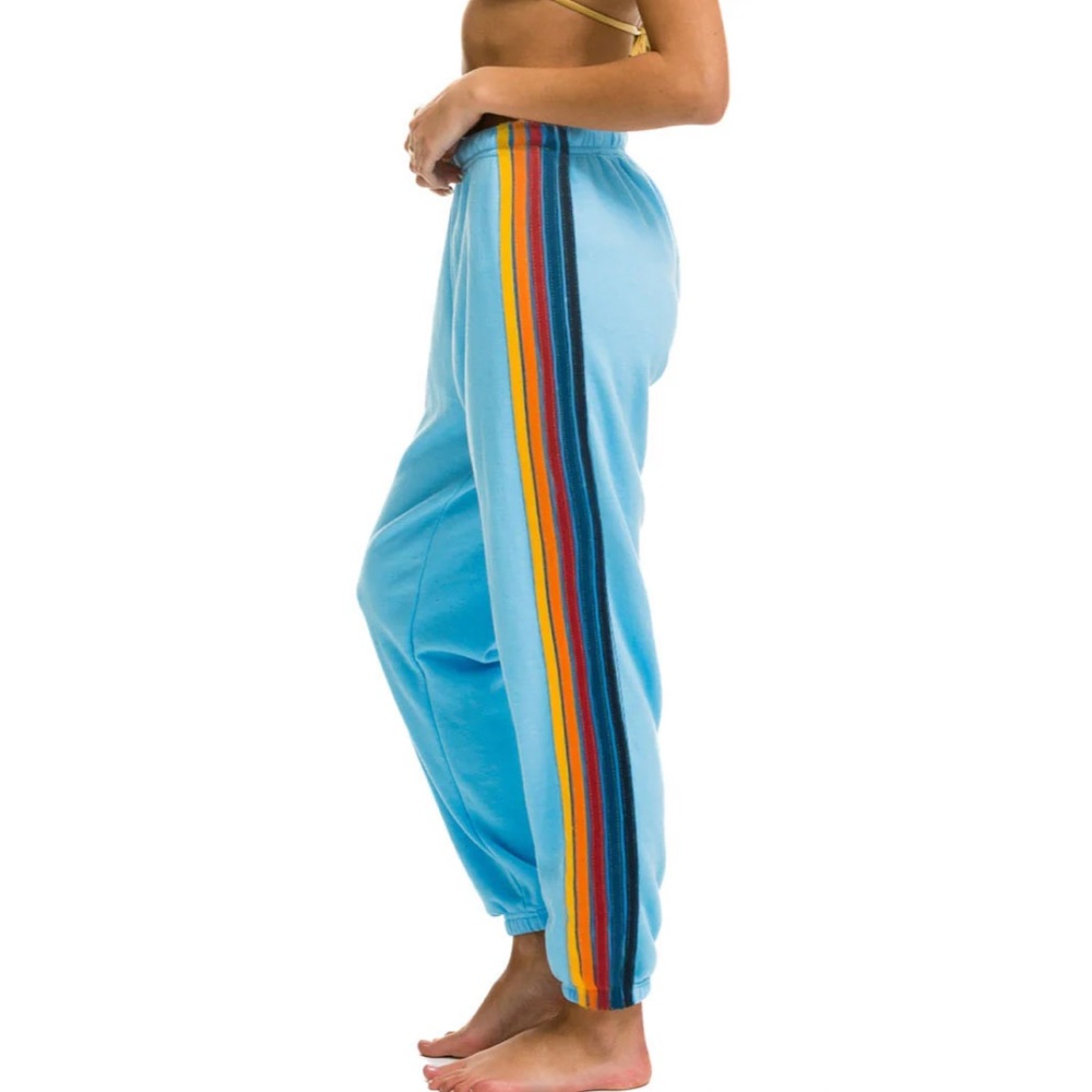 Aviator Nation blue sweatpants with rainbow stripe